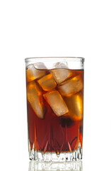 A glass of iced tea with ice cubes in it