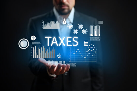 Businessman presenting tax and financial data in a modern, digital style at a dark backdrop