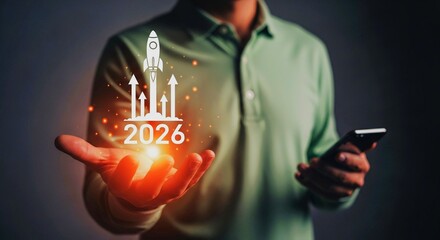 A man holding a rocket launch graphic with the year 2026, symbolizing future business growth.