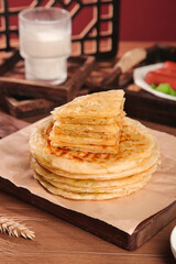 Crispy Handmade Scallion Pancakes with Butter on Wooden Serving Tray