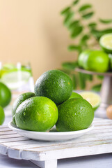 Fresh Green Limes on White Plate - Healthy Citrus Fruit for Cooking and Cocktails
