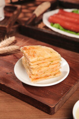 Handmade Scallion Pancakes with Butter and Green Onions on Wooden Board