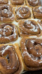 Freshly Baked Cinnamon Rolls with Icing – Close-Up of Sweet Pastry in Baking Tray