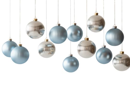 Hanging christmas ornaments in silver and blue against a dark on transparent background