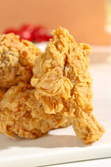 Crispy Golden Fried Chicken Thighs with Crunchy Coating on White Plate