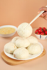 Handmade Fresh Meat Buns with Scallion - Traditional Asian Steamed Dumplings with Chopsticks