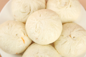 Fresh Handmade Steamed Buns with Scallion and Meat Filling Display on White Plate