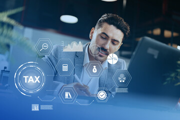 Professional man working on tax documents in an office with digital graphics overlay