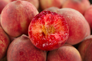 Fresh Red Flesh Peaches Cut in Half Showing Juicy Interior - Premium Stone Fruit