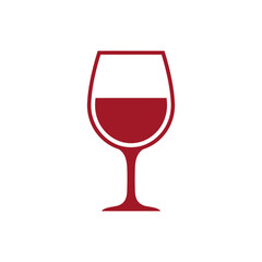 Glass of red wine sits on white table, ready to be enjoyed during a relaxing evening, creating a cozy and inviting atmosphere.