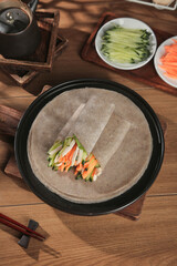 Making Buckwheat Vegetable Pancakes - Healthy Breakfast Burrito Style Meal Preparation on Rustic Wooden Table