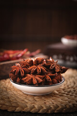 Dried Star Anise Spice in Bowl with Red Chili Peppers - Asian Cooking Ingredients from Guangxi