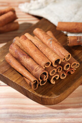 Natural Cinnamon Sticks from Guangxi on Wooden Board - Aromatic Spice Seasoning for Cooking