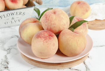 Fresh Yangshan Peaches on White Plate - Ripe Stone Fruit Harvest Display