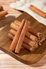 Natural Guangxi Cinnamon Sticks on Wooden Board - Aromatic Cooking Spice Seasoning