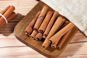 Natural Cinnamon Sticks on Wooden Board - Aromatic Spice Seasoning from Guangxi China