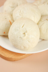 Handmade Steamed Meat Buns with Scallions on White Plate - Traditional Asian Dumplings