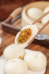 Handmade Pork Buns with Fresh Scallion Filling in Traditional Bamboo Steamer - Asian Dumpling Cuisine