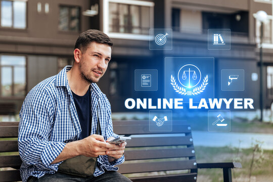 Young man using smartphone to consult an online lawyer in a modern urban setting