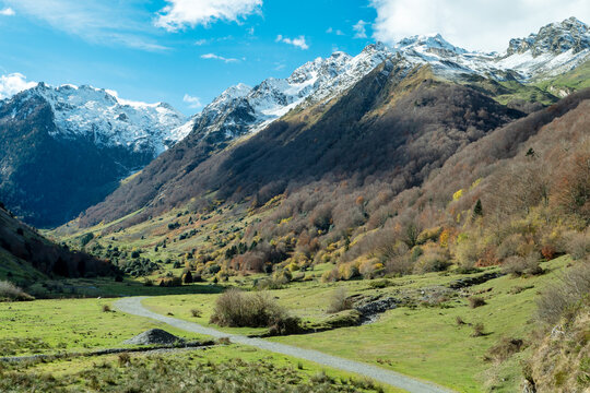 View of the snow-capped Pyrenees, near Lake Estaing, France - Powered by Adobe
