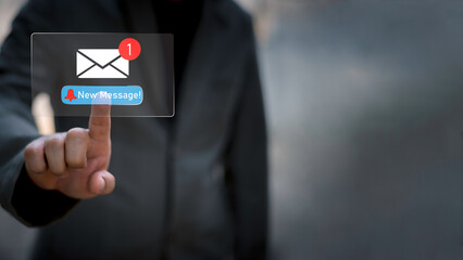 Businessman touching new message notification icon on virtual screen,email alert, online messaging system, representing digital communication, instant response, and business connectivity.