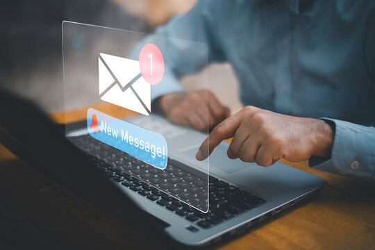 Businessman touching new message notification icon on virtual screen,email alert, online messaging system, representing digital communication, instant response, and business connectivity. - Powered by Adobe