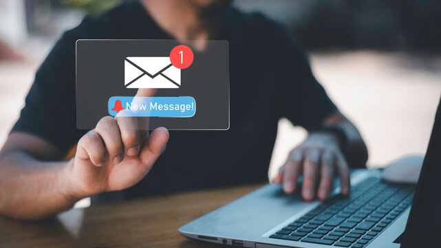 Businessman touching new message notification icon on virtual screen,email alert, online messaging system, representing digital communication, instant response, and business connectivity. - Powered by Adobe