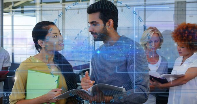 Gesturing man in grey sweater with open notebook leading office talk with green folder blue HUD