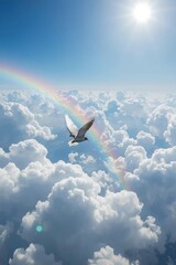 A bird soars through fluffy clouds under a bright sun with a rainbow