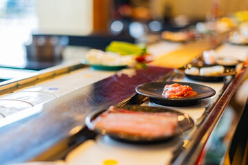 Food on a conveyor belt in a restaurant