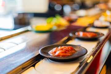 Food on a conveyor belt in a restaurant