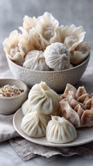 Fototapeta premium Variety of asian dumplings on plates with sauces and fillings