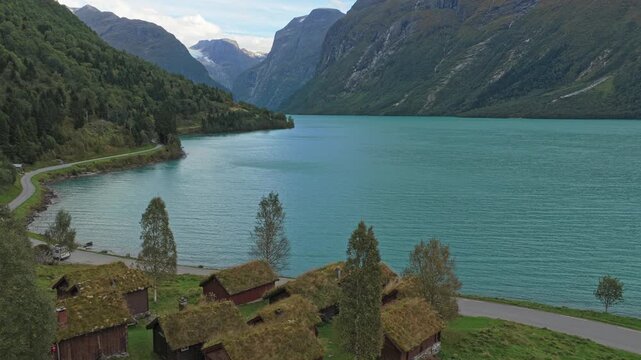 Breng seter farm houses by Lovatnet glacier lake in Norway, drone view