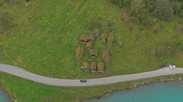 Aerial of Breng seter by clear Lovatnet lake in Norway mountains