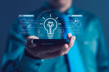 Businessman Holding Smartphone with Digital Light Bulb and AI Icons for Innovation, Online Learning, Cloud Technology and Smart Ideas