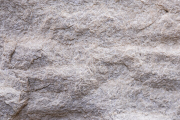 Natural stone texture showcasing intricate patterns and subtle variations in color and shape on a smooth surface