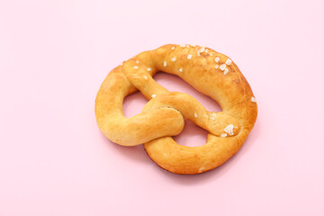 Soft pretzel on pink background
