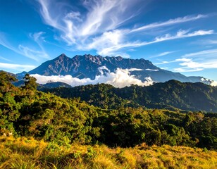 Mountain range panorama under a vibrant blue sky with wispy clouds