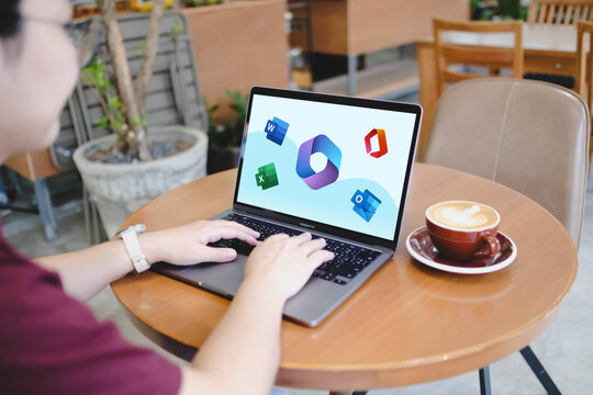 Bangkok, Thailand. November 14, 2025; A person using the Microsoft 365 suite on a MacBook Pro, with logos for Word, Excel, and Outlook on screen.