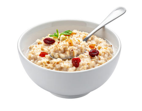 Bowl of red soup with herbs and spices a traditional meal on a plain background with a spoon in the bowl showing a close up of the texture and ingredients