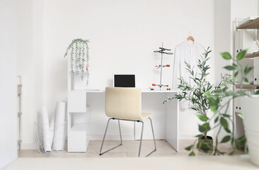 Workplace with laptop and laboratory stand in medical office