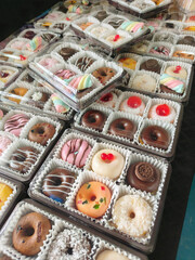 Colorful Donuts, Berliner, Krapfen with sugar icing and chocolate.