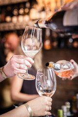 wine is poured into a glass