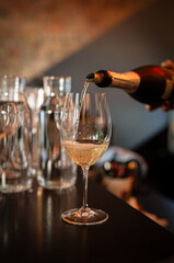 wine is poured into a glass