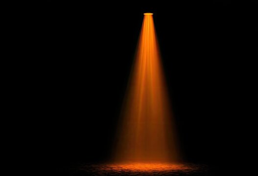 Orange spotlight beam on black background (1)