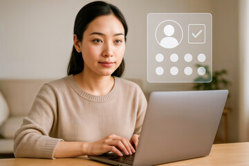 Woman at laptop with user profile icon for identity verification or login.