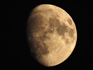 moon in waxing gibbous phase in the dark sky
