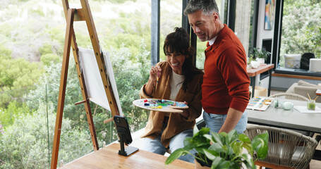 Canvas, couple and painting with phone in home for art inspiration, creative activity and support....