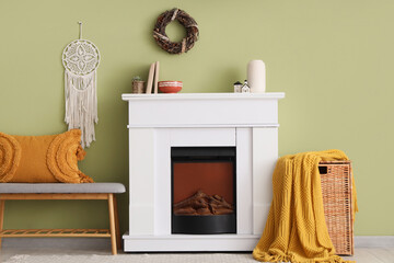 Fototapeta premium Interior of living room with soft bench, fireplace and basket