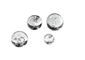 Glass spheres with trapped air, bubbles on a black plane